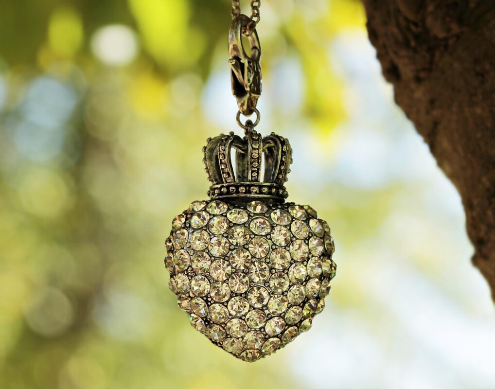 A birthstone pendant necklace with a coloured stone